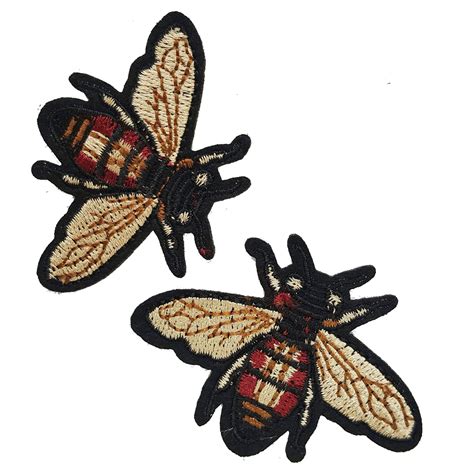 gucci fly logo